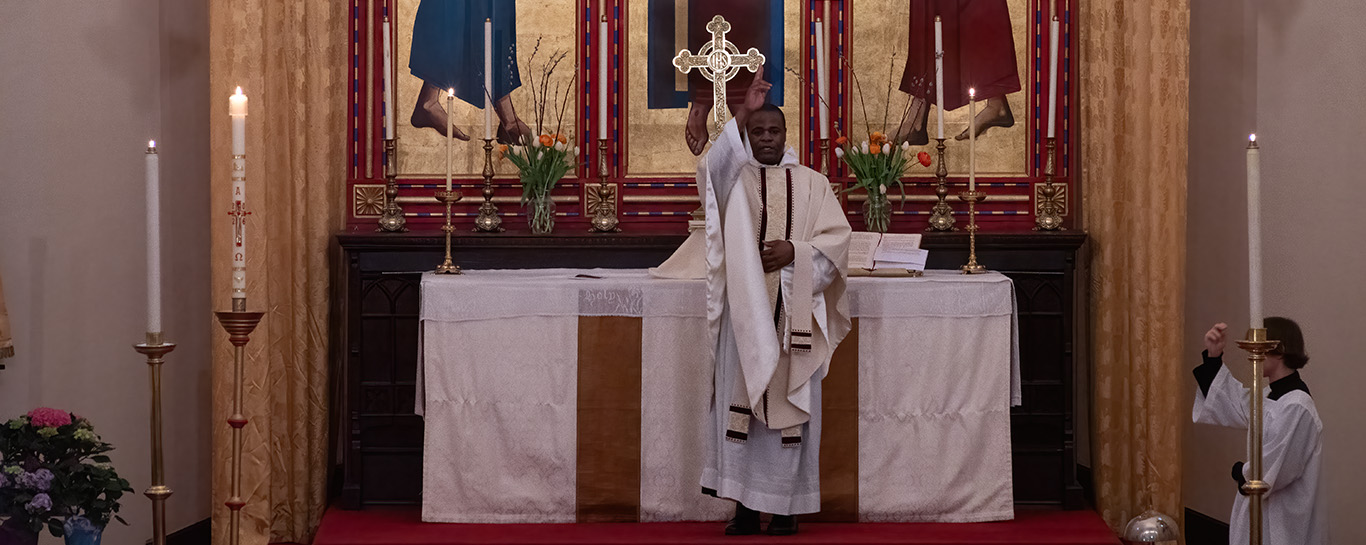 Fr Kwari gives the blessing during Low Mass on the Third Sunday of Easter