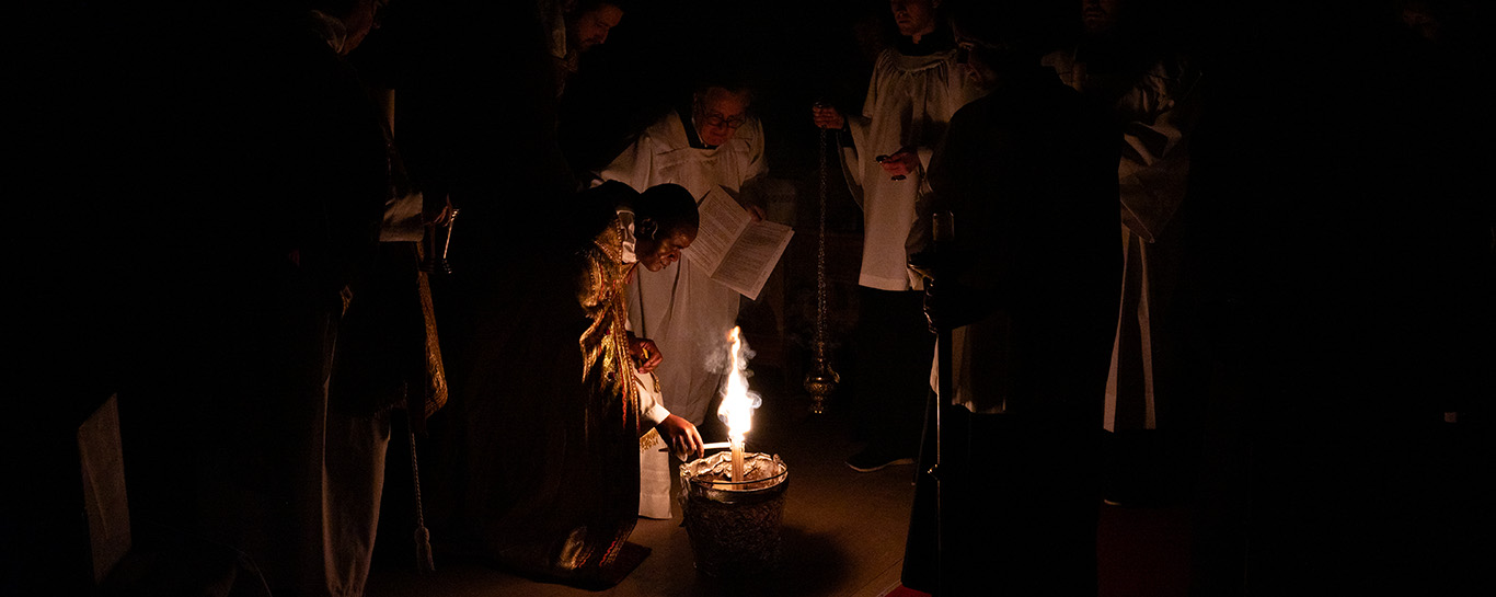 Fr Kwari kindles a new fire during the Easter Vigil