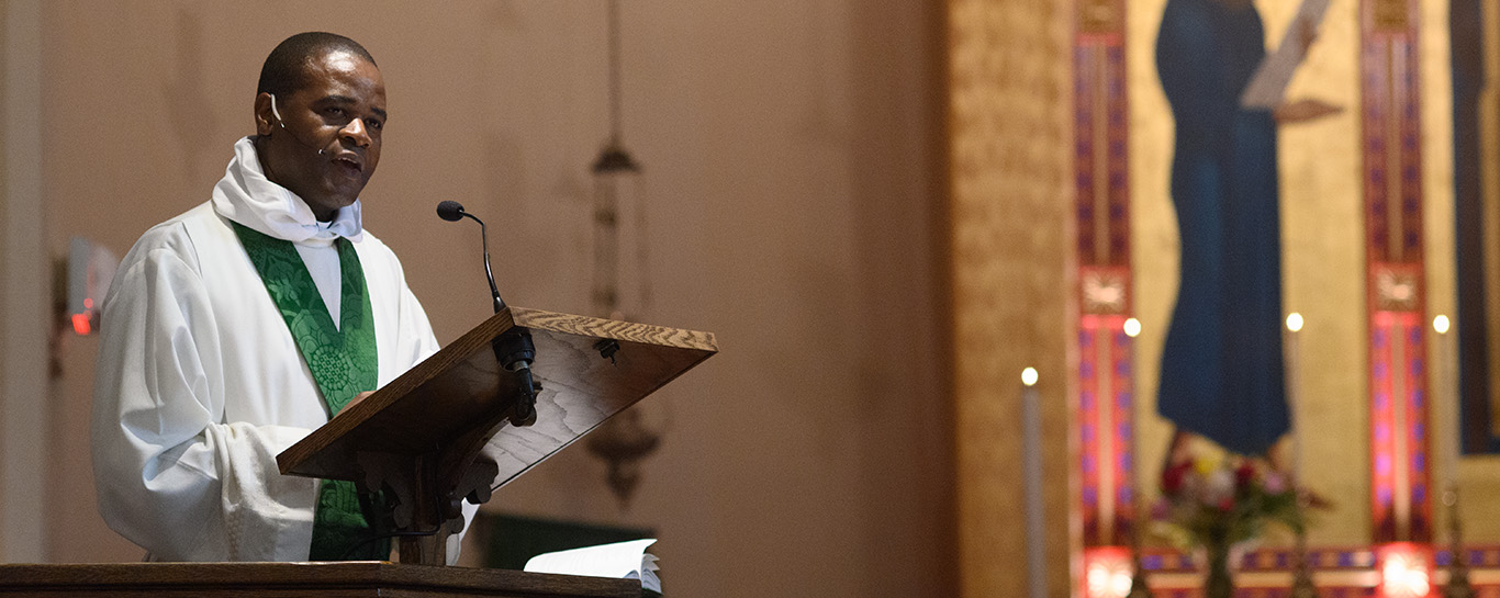 Fr Kwari gives the homily during Trinity III