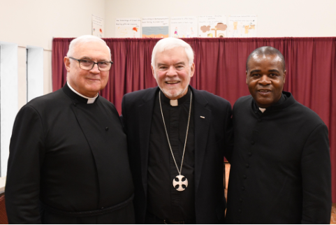 Fr Young at his anniversary reception with retired Bishop Peter Coffin and Fr George Kwari.