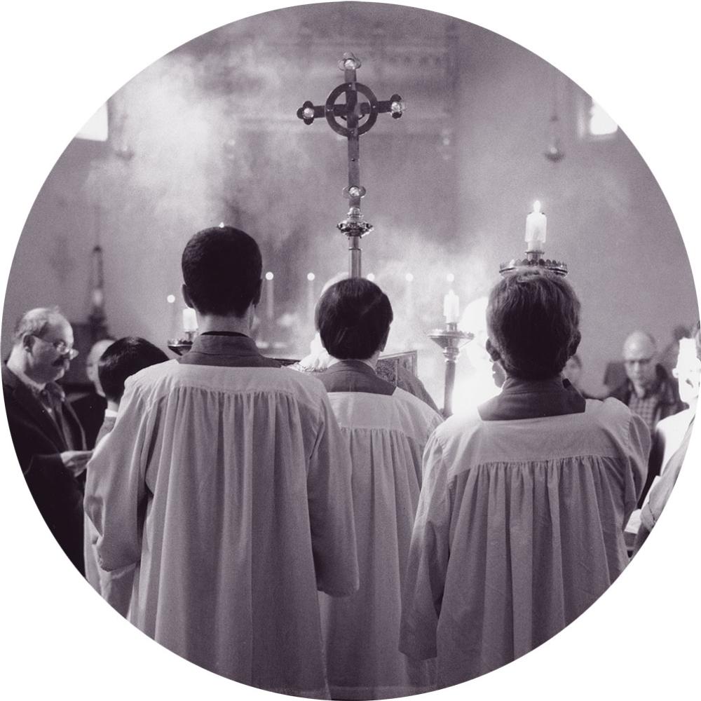 Three servers with crucifix